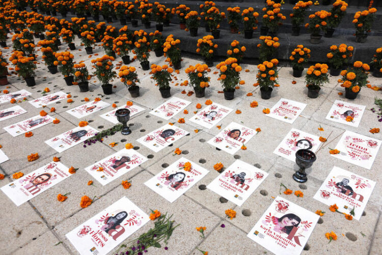Photographs of murdered journalists and activists are seen at an altar on the eve of the Day of the Dead in Mexico City, Mexico, October 31, 2022. REUTERS/Gustavo Graf - RC2JCX9FVYUV
